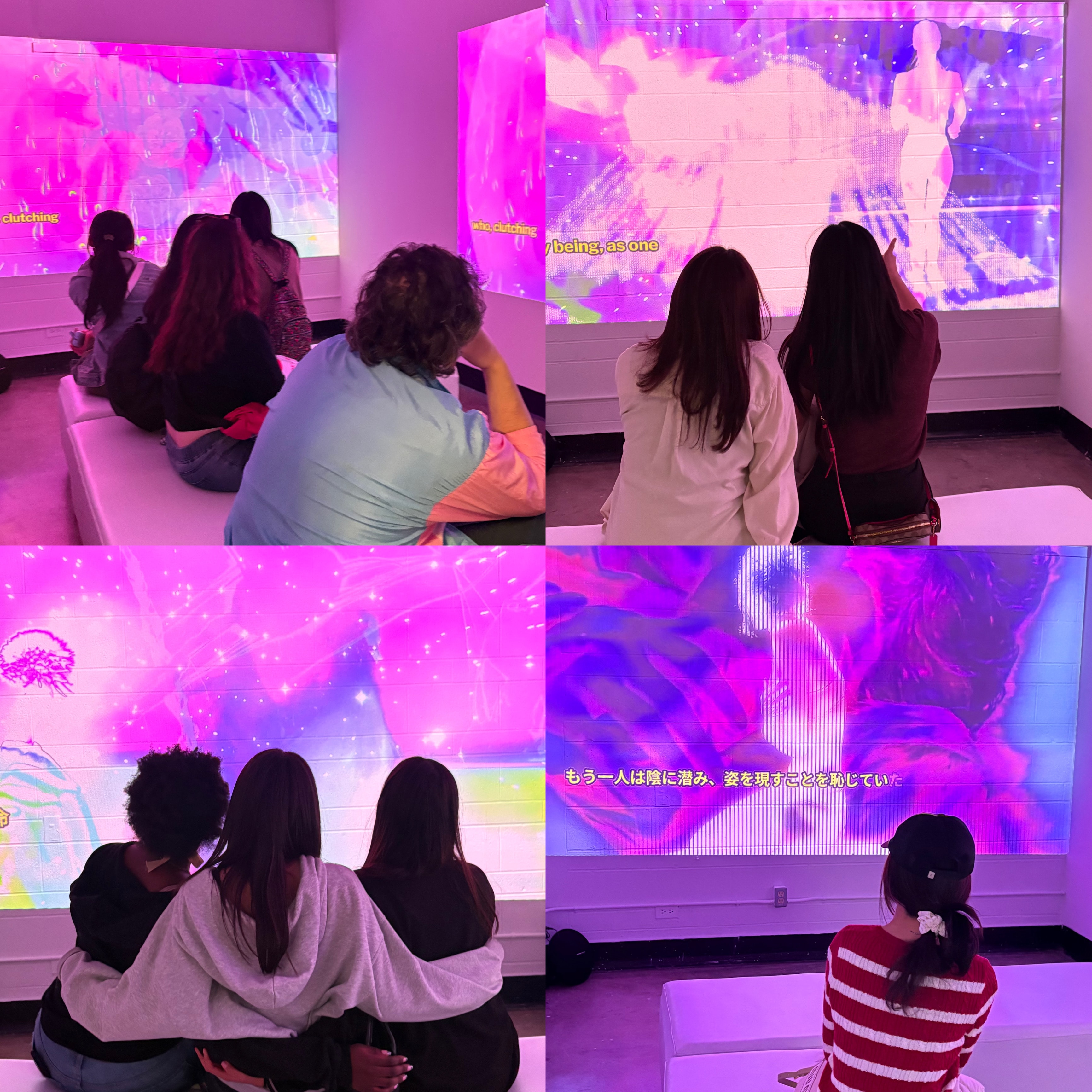 Audience viewing pink, purple, and blue projection installation